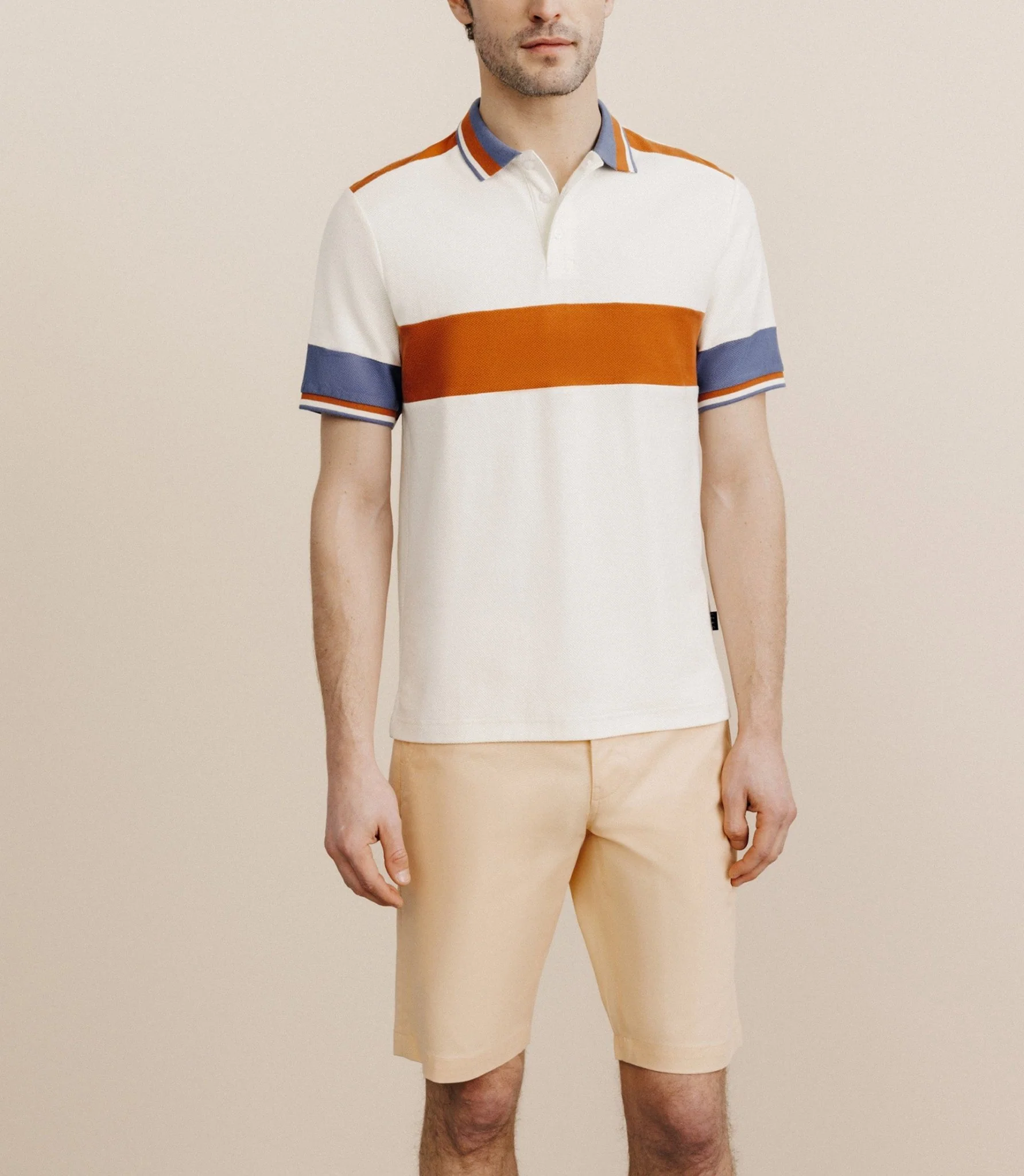 Polo boutonné à bandes pêche